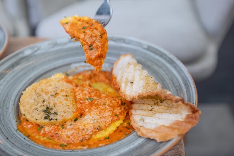 Crispy chicken parmesan with tomato sauce and melted cheese