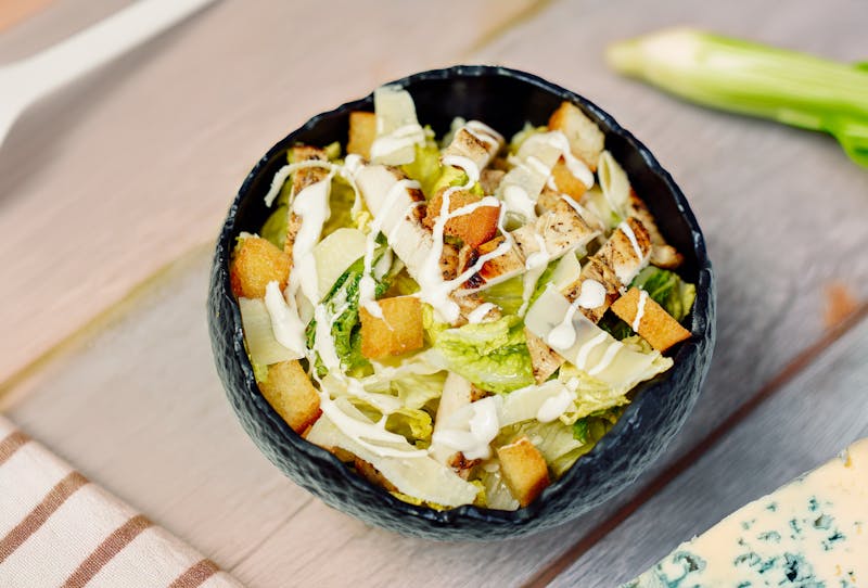 Classic Caesar salad with grilled romaine and croutons
